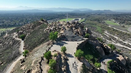 Riverside, California – Aerial Shot of Mount Rubidoux with Hikers, Cross, and Tower Bridge in the Summer in Downtown Riverside, CA Overviewing the Mountains