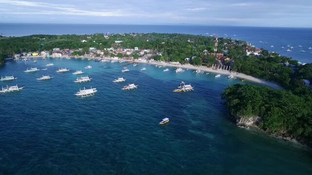 Logon Beach and Boats in Malapascua Island Seashore in Cebu, Philippines. Sulu Sea, Boats and Beautiful Seascape in Background. Drone