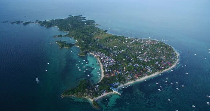 Logon Beach and Boats in Malapascua Island Seashore in Cebu, Philippines. Sulu Sea, Boats and Beautiful Seascape in Background. Drone 4k