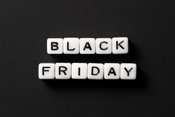 Obraz premium Close-up of Black Friday sale text made of acrylic beads on a black background. High-resolution photo. Discount cards.