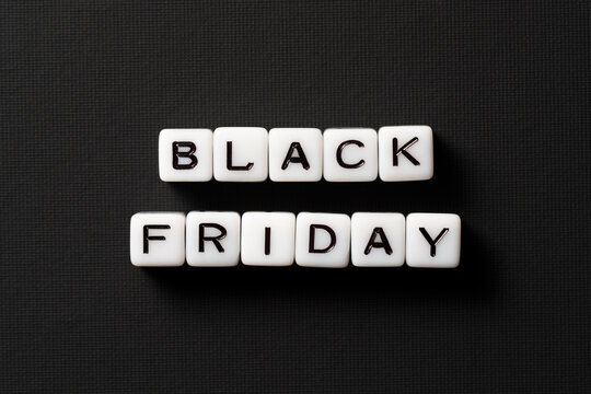 Close-up of Black Friday sale text made of acrylic beads on a black background. High-resolution photo. Discount cards.