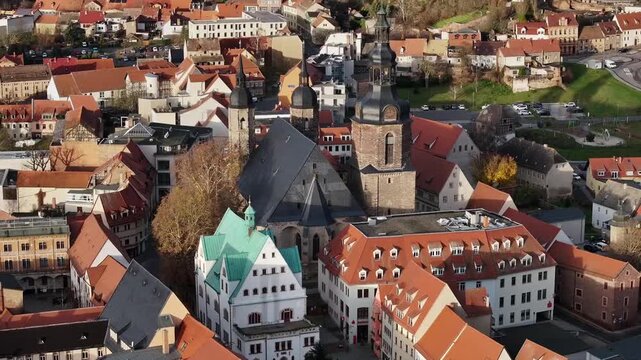 Short drone flight over Eisleben&rsquo;s market square in Saxony-Anhalt, showcasing historic streets and architecture.