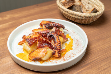 Grilled octopus with potatoes and paprika, spanish tapas