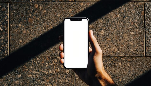 Smartphone in Sunlight: A modern smartphone, its screen illuminated, is held against a textured backdrop bathed in the warmth of sunlight, symbolizing connection and information.