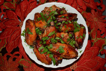 Oven-baked chicken wings glazed with soy and honey sauce. Delicious homemade dish with golden crispy skin and savory flavor.