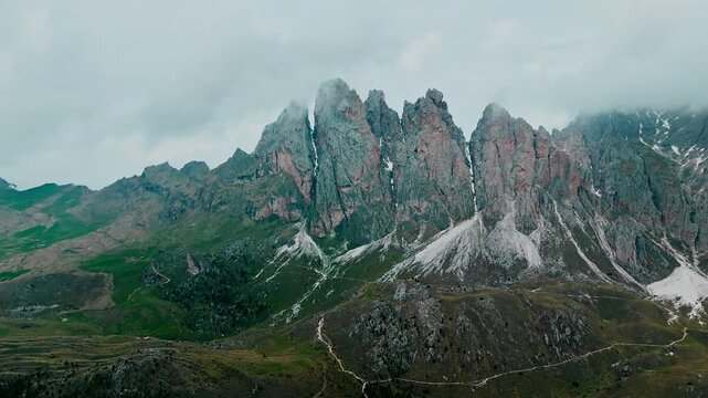 Majestic mountain landscape with dramatic rock formations Seceda in Odle Geisler Group in Dolomites under a cloudy sky, South Tyrol in Northern Italy