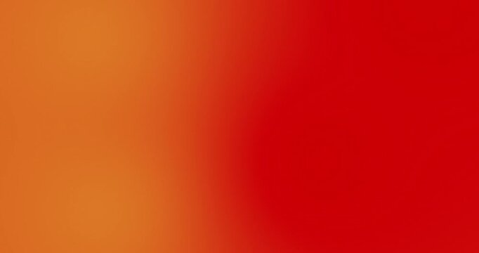 Abstract blurred bright orange and vibrant red color gradient background video. Smooth warm tones with soft fade and saturated colors. Energetic backdrop loop for motion graphics, presentations