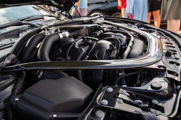 The vehicle open engine a car hood for safety test