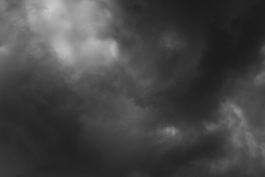 Dark storm sky with dramatic fluffy clouds. Cloudscape rainy season. Thunderstorm climate weather. Pollution smoke PM 2.5 Cabo dioxide concept. Scary Halloween.