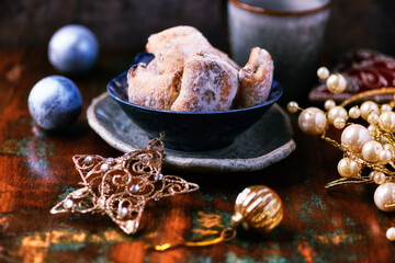 Traditional christmas cookies in a bowl on a rustic wooden background. Soft focus.	