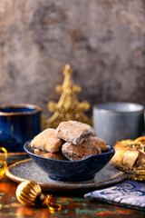 Traditional christmas cookies in a bowl on a rustic wooden background. Soft focus.	