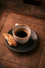Cup of coffee on rustic wooden background. Soft focus. Copy space	
