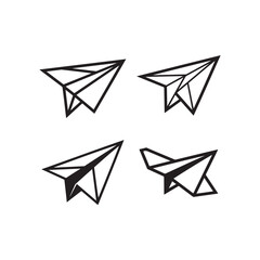 a minimalist arrangement of four black paper airplanes floating in a still life stark against a white background silhouette