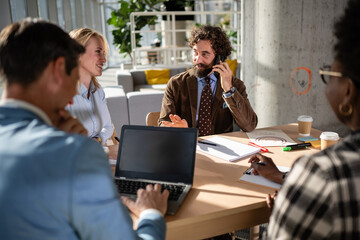 Business people having meeting, collaborating in modern office
