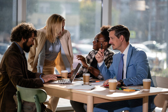 Diverse business team collaborating during office meeting