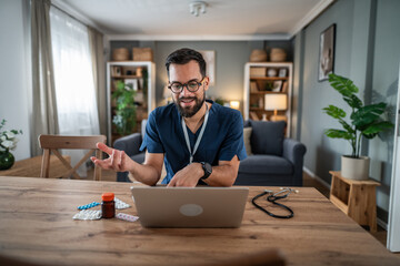 Doctor having a telemedicine video consultation on laptop