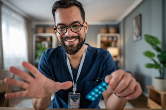 Male doctor providing medication on virtual telemedicine video call