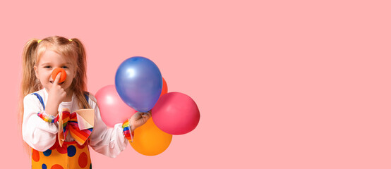 Cute little girl in clown costume with balloons on pink background © Pixel-Shot