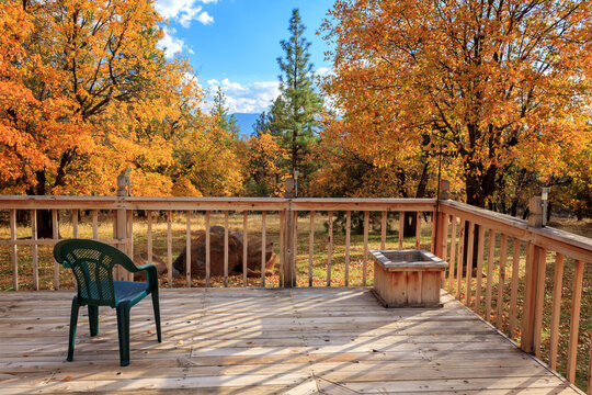 Autumn On The Deck with Beautiful Colorful Trees and a View of the Mountains and Pine Trees