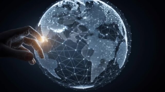 A hand is touching a globe with a finger. Concept of connection and unity between people and the world