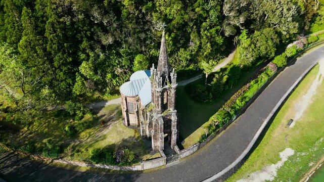Drone footage of Capela de Nossa Senhora das Vitorias church on Furnas Lake in Furnas, Sao Miguel, Azores