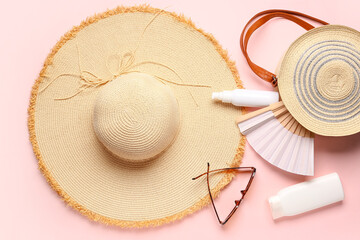 Composition with beach accessories and cosmetic products on color background