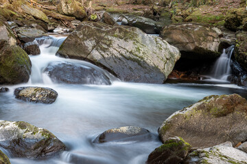 Fototapeta premium Long exposure of a waterfall on the East Lyn river at Watersmeet in Exmoor National Park