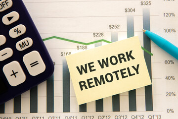A close-up of a woman pointing at a credit card on a table