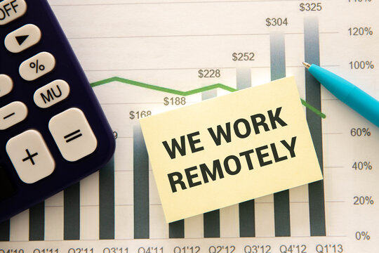 A close-up of a woman pointing at a credit card on a table