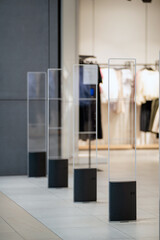 Radio-frequency security gates with integrated metal detector at a clothing store entrance