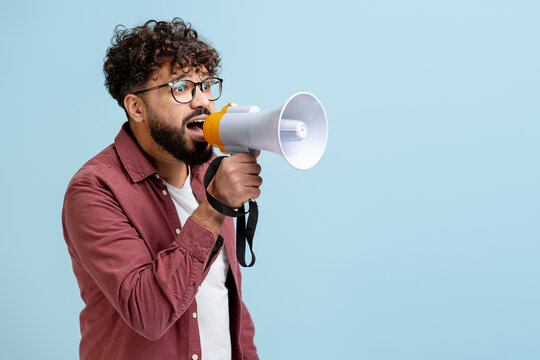 Man shouting into a megaphone, expressing opinion and making a loud announcement - Powered by Adobe