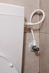 Bathroom and plumbing. Toilet connections. Close-up