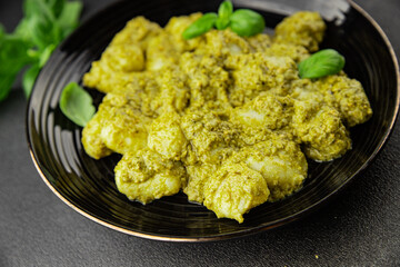 Gnocchi pesto sauce green tasty snack fresh gourmet food background on the table rustic top view copy space vegerian and vegan food