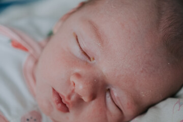 Portrait of sleeping peacefully newborn baby boy in bed. Healthy Infant napping in bed. Adorable one Month old babyhaving rest at night