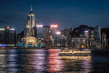 Scenic, awesome night view of Victoria Harbour in front of Hong Kong's fantastic skyline with its impressive illuminated skyscrapers, Hong Hong, China