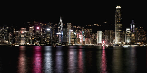 Scenic, awesome view of Victoria Harbour and Hong Kong's fantastic skyline with its impressive skyscrapers illuminated at night, Hong Kong, China
