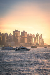 Scenic, awesome view of Hong Kong's fantastic skyline, with its impressive skyscrapers, against a dramatic sunset and sky, Hong Kong, China