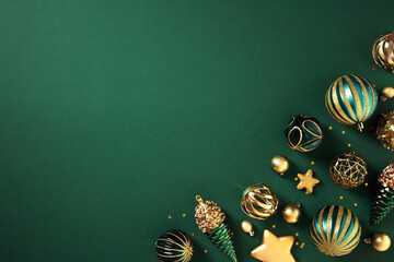 Luxury gold Christmas decorations on dark green background. Xmas greeting card template, Happy New...