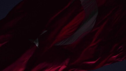 Waving Turkish Flag at night. National holidays of Turkey concept 4k video.