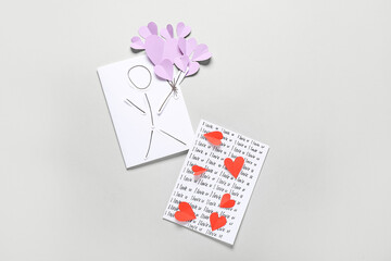 Greeting cards for Valentine's Day celebration on grey background