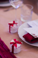 Coziness and style. Modern event design. Table setting at wedding reception. Floral compositions...
