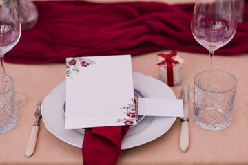 Coziness and style. Modern event design. Table setting at wedding reception. Floral compositions...