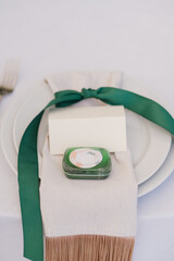 Coziness and style. Modern event design. Table setting at wedding reception. Floral compositions...