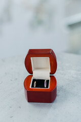 Modern wedding jewelry. Closeup of two wedding rings in a vintage box.
