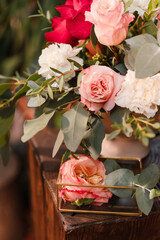 Modern wedding jewelry. Closeup of two wedding rings in a vintage box with flower petals.