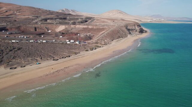 Aerial drone view of Los Canarios beach and the turquoise Atlantic Ocean in Fuerteventura, Spain