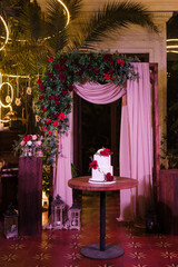 Stylish modern wedding cake. Beautiful decorated delicious dessert with several layers.