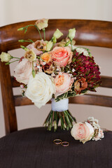 Wedding morning composition. Bridal look details of fresh bouquet and leather shoes.