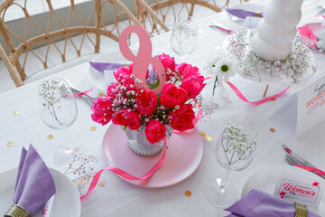 Elegant table setting with beautiful tulips for International Women's Day celebration