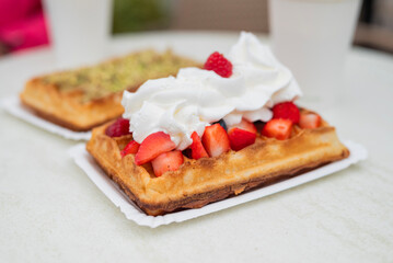 Gdansk , Poland, delicious waffles with whipped cream and berries
